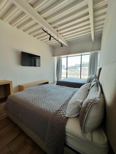 Olson Hotel Real Acueductoにあるベッド