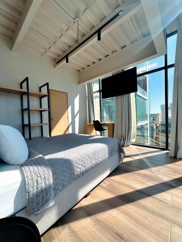 Olson Hotel Real Acueductoにあるベッド