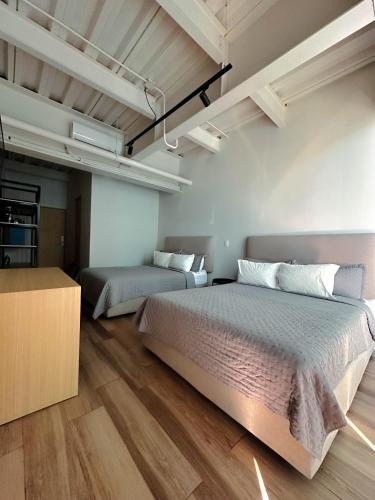 Olson Hotel Real Acueductoにあるベッド