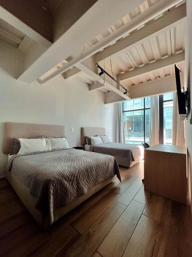 Olson Hotel Real Acueductoにあるベッド