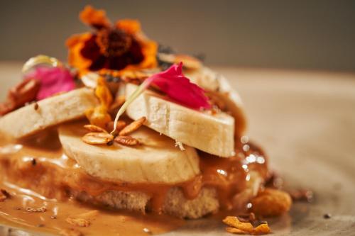 a piece of cake with peanut butter and flowers on it at Hotel Atlante Plaza in Recife