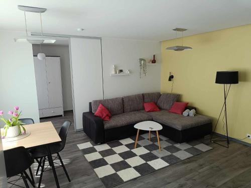 a living room with a couch and a table at Pärnu südalinna majutus in Pärnu