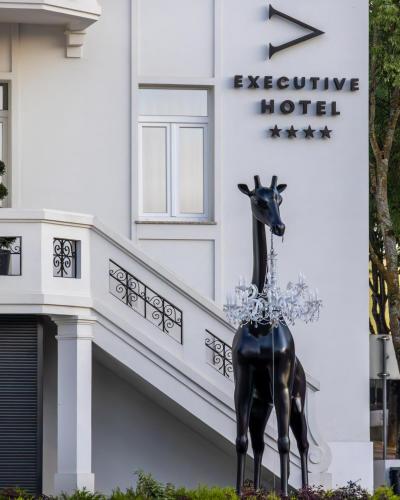 a statue of a horse in front of a hotel at VISEU EXECUTIVE Hotel in Viseu