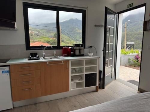 a kitchen with a sink and a window at GuestReady - Tranquil Retreat in Nature's Embrace in São Vicente