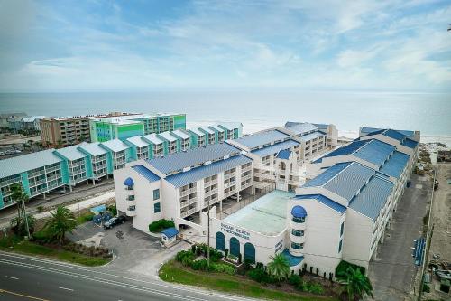 an aerial view of a building next to the ocean at Sugar Beach 301 by Vacation Homes Collection in Gulf Shores