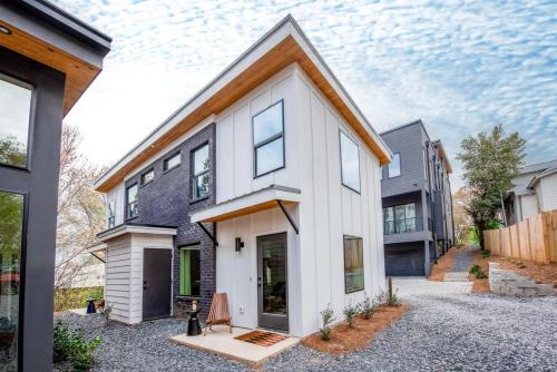 a white house with a brown roof at Champagne Wishes in Atlanta