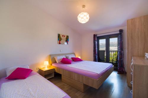 Posteľ alebo postele v izbe v ubytovaní Apartment Masuni