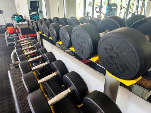 a row of dumbbells in a gym at Tamala Beach Resort in Kotu