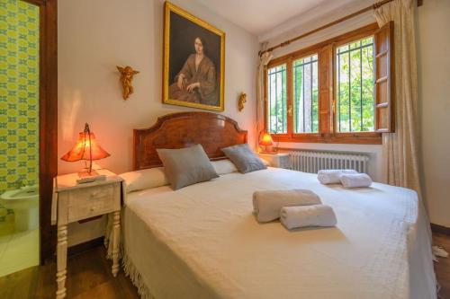 En eller flere senge i et værelse på Villa del Almirante