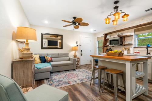 a kitchen and living room with a couch and a table at Autumn Creek Branson in Branson