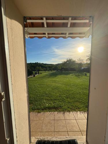 a view of a field from the door of a house at Chambre d'Hôtes Arla Goxoki in Amendeuix-Oneix