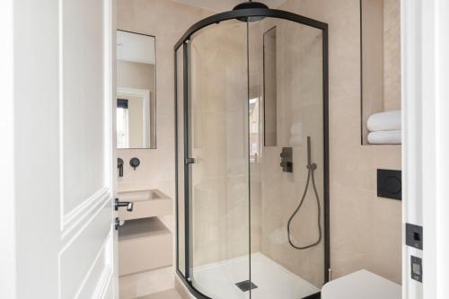 a shower with a glass door in a bathroom at Skyvillion -COZY & AMAZING King 1Bed Apartment in London Cockfosters Mins to Tube in Cockfosters