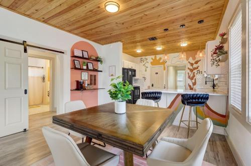 a kitchen and dining room with a wooden table and chairs at The Retro Retreat - Close to Downtown, Fort Sam in San Antonio