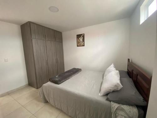 Ένα ή περισσότερα κρεβάτια σε δωμάτιο στο Apartamento Descanso Central