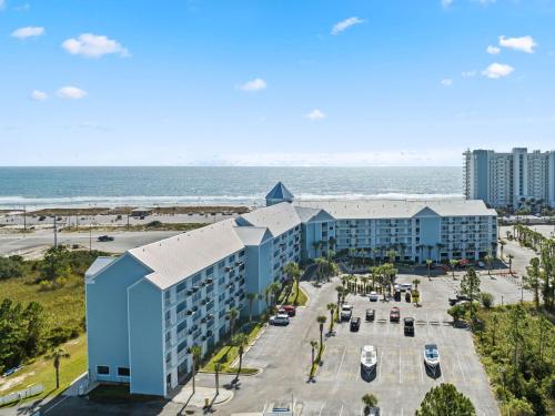 an aerial view of the resort with the ocean in the background at Grand Caribbean 115 by Vacation Homes Collection in Orange Beach