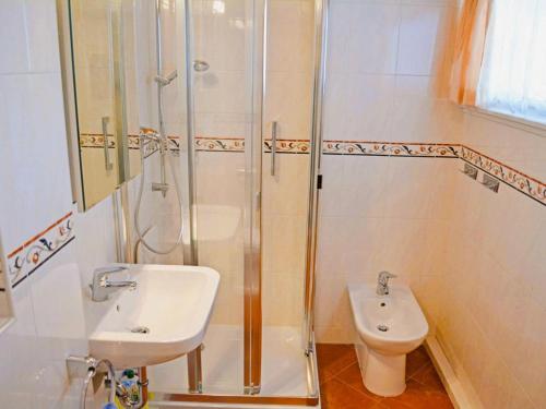 a bathroom with a sink and a shower and a toilet at Sunny Stay with Mountain in Siegsdorf