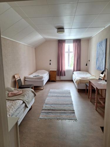 Postel nebo postele na pokoji v ubytování Hurdal Gjestegård