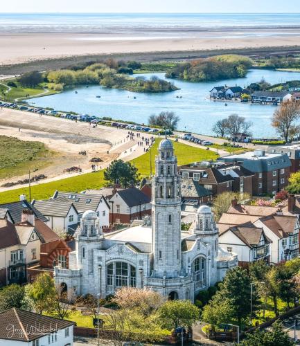 an old building in a town with a beach at Cumbria Guest House in Lytham St Annes