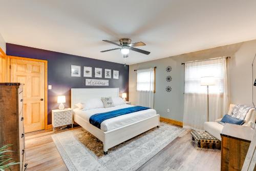 a bedroom with a bed and a ceiling fan at Pet-Friendly Pocono Lake Home with Private Hot Tub! in Pocono Lake