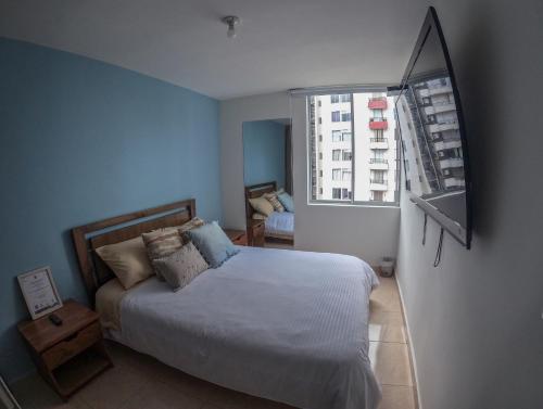 Postel nebo postele na pokoji v ubytování Apartaestudio Norte de Armenia