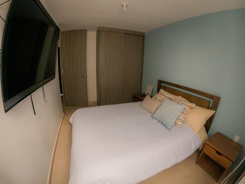 Postel nebo postele na pokoji v ubytování Apartaestudio Norte de Armenia