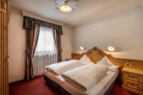 Ένα ή περισσότερα κρεβάτια σε δωμάτιο στο Residence Vila