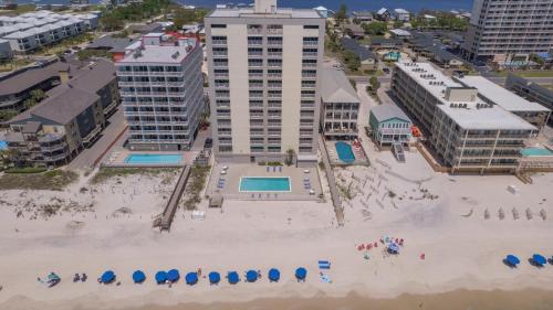 an aerial view of a beach with umbrellas and buildings at Gulf Tower 3C by Vacation Homes Collection in Gulf Shores