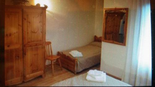 Postel nebo postele na pokoji v ubytování Hotel Lares