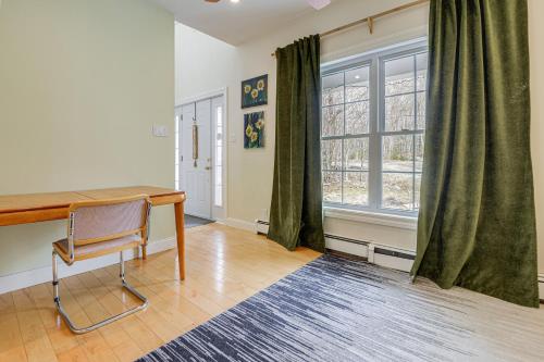 a home office with a desk and a window at 6 Mi to Mt Snow Nature-View Home with Fire Pit! in West Dover