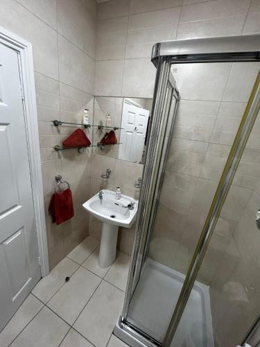 a bathroom with a sink and a shower at 29 Cill Ard Bohermore Galway City in Galway