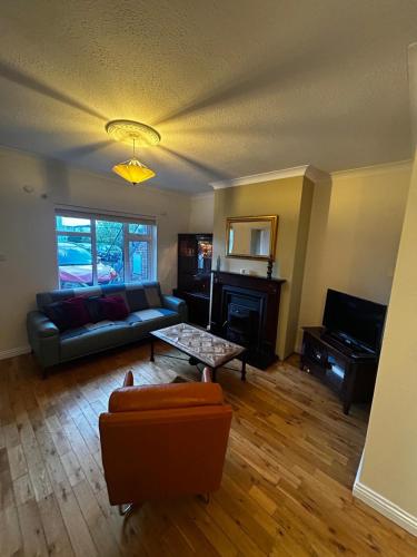 a living room with a couch and a table at 29 Cill Ard Bohermore Galway City in Galway
