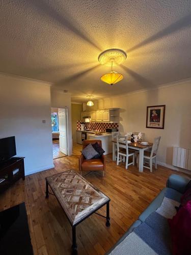 a living room with a couch and a table at 29 Cill Ard Bohermore Galway City in Galway