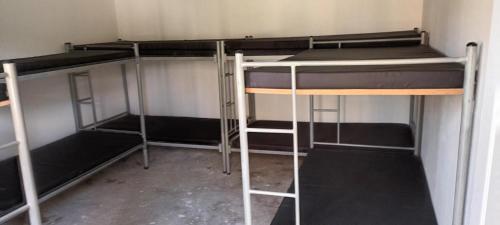 a group of bunk beds in a room at Finca Villa Mariana in Papagalleros