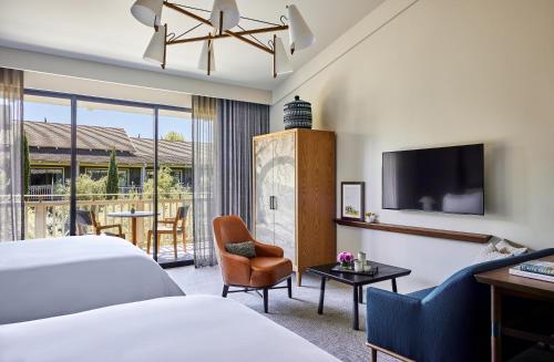 a hotel room with a bed and a tv at Rosewood Sand Hill in Menlo Park