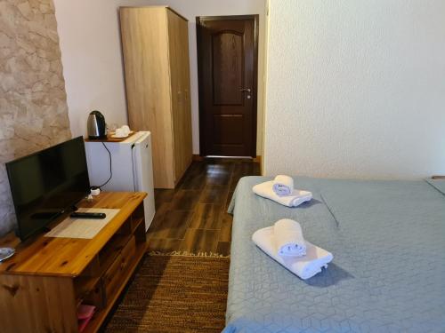 Postel nebo postele na pokoji v ubytování Apartments Zec