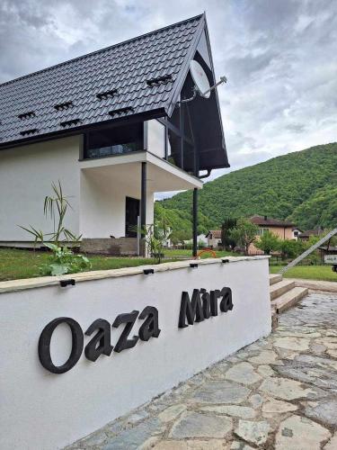 a sign in front of a house with a camera at Oaza mira 1 in Jajce