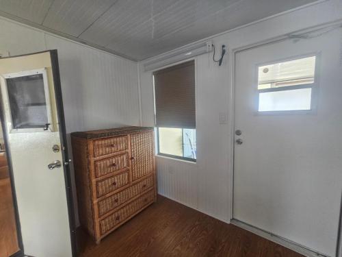 an empty room with a door and a window at Woody's RV Resort LLC in Sebring