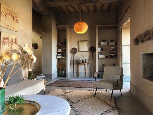 a living room with a couch and a table at Dar faracha in Ouarzazate