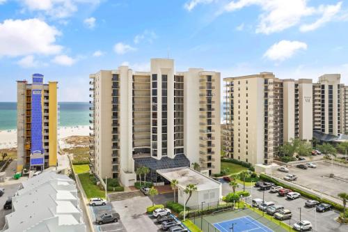 an aerial view of apartment buildings and the beach at Phoenix VIII 81201 by Vacation Homes Collection in Orange Beach