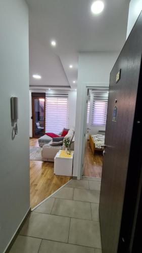 a living room with a couch and a living room at Apartman Moj kutak Zlatibor in Zlatibor