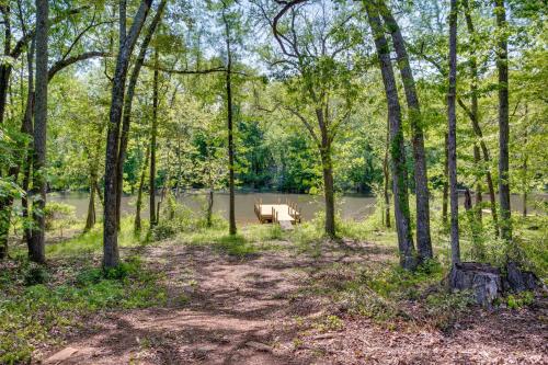 a park with a bench in the middle of a forest at Troy Cabin with River Access Fish, Kayak and More! in Troy