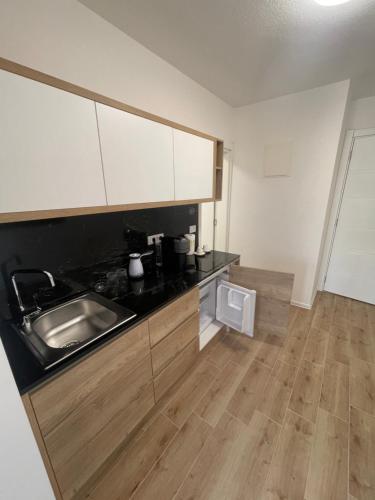 a kitchen with a sink and a counter top at Apartmani Vidikovac in Prijepolje