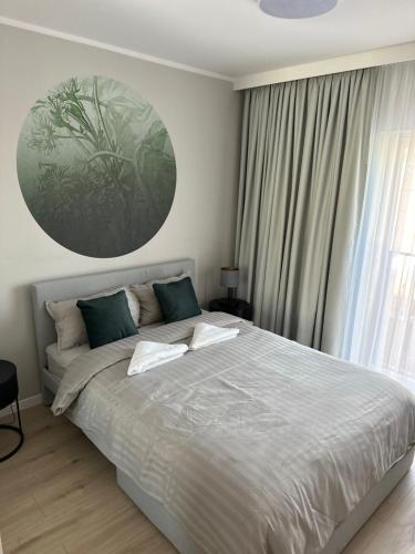 Ένα ή περισσότερα κρεβάτια σε δωμάτιο στο Apartamenty Wroclawia Centrum