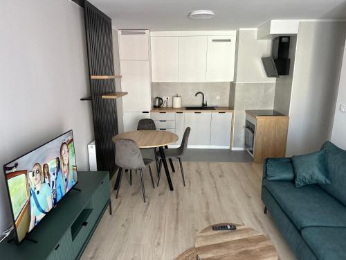 Η κουζίνα ή μικρή κουζίνα στο Apartamenty Wroclawia Centrum