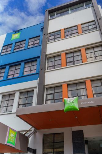 a building with a bus sign in front of it at Ibis Styles Invercargill in Invercargill