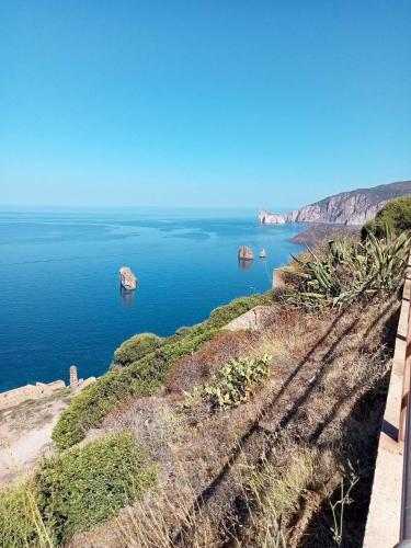 a view of the ocean with rocks in the water at La Perla e le Conchiglie Tanca Piras vista mare in Nebida