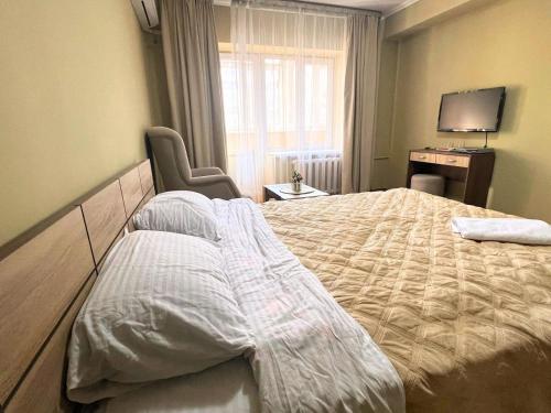 Postelja oz. postelje v sobi nastanitve Samal Suites