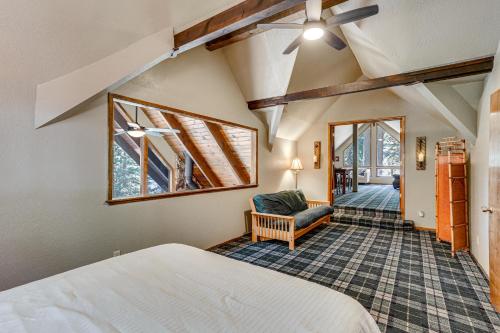 1 dormitorio con 1 cama y 1 silla en una habitación en Spacious Retreat with Backyard 1 Mi to Lake Almanor en Lake Almanor