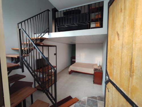 a room with a staircase leading to a bedroom at Casa Buenavista in Buenavista
