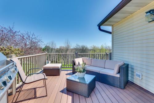 a patio with a couch and chairs on a deck at Prairie du Chien Home with Yard 3 Mi to River! in Prairie du Chien